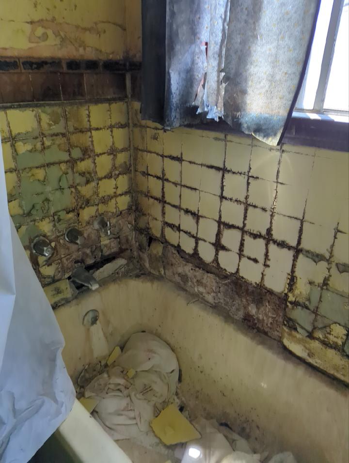Distressed bathroom needing major repairs in Tyrone's inherited California house